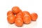 A pile of fresh picked Minneola Tangelos on white