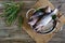 A pile of fresh raw fish on a wooden background. Top view. Carp.