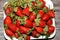 Pile of fresh strawberries fruit, the garden strawberry is a widely grown hybrid species of the genus Fragaria ananassa with its