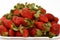 Pile of fresh strawberries fruit, the garden strawberry is a widely grown hybrid species of the genus Fragaria ananassa with its