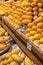 Pile of fresh yellow ripped Thai mango names Mamuang Kaew displayed on fruits stall shop