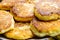 Pile of freshly fried homemade fluffy pancakes from cottage cheese on plate. Appetizing golden crust. Close up shot. Food poster