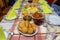 A pile of fried, stuffed Polish croquettes lying on a decorated table, visible mushrooms and beets.