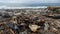 Pile of garbage lying on the seashore against the background of tides of sea waves, close-up view in slow motion