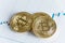 Pile of gold bitcoin cryptocurrency coin on candlestick trading