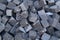 Pile of gray cube granite stones