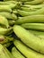 Pile of green plantains on sale at a market