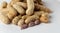 Pile group of boiled peanut, boiled peanut bean fall down pour on ground. Tropical boiled peanut shot close up. White background