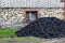 a pile of hard coal in front of the house, supplies for the winter