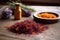 pile of harvested saffron stigmas on wooden table