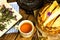 Pile of homemade wafers with tea, book and flowers