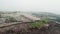 A pile of household trash with soil. Garbage landfill, top view.