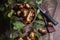 Pile of Imleria Badia or Boletus badius mushrooms commonly known as the bay bolete with knife on vintage wooden background