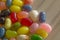 Pile of jelly beans multi color on wood table