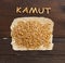 Pile of Kamut grain with wooden letters