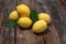 Pile lemon in bowl on wood background