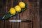 Pile lemon in bowl on wood background