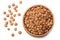 Pile lentil in wooden bowl isolated on white background. Top view.