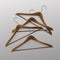Pile of Lying Clothes Coat Brown Wooden Hangers