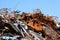 pile of many rusty pieces of iron in the recycling center for th