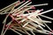 Pile of matchsticks on black background