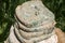 Pile of moldy slices and loaf of bread closeup