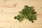 Pile of moringa tree leaves on wood