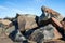 Pile of multicolored rocks and boulders as coastal erosion beac