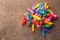 Pile of not inflated balloons different colors on the wood background.