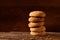 Pile of oat cookies on wooden table, close-up, selective focus.