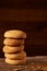 Pile of oat cookies on wooden table, close-up, selective focus.