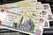 Pile of obverse side of 200 LE two hundred Egyptian pounds banknote features Qani-Bay mosque in Cairo Egypt, selective focus of