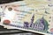 Pile of obverse side of 200 LE two hundred Egyptian pounds banknote features Qani-Bay mosque in Cairo Egypt, selective focus of