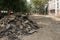 A pile of old asphalt pavement. Renovation of the road. The details of the repair of asphalt roads