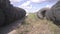 Pile of old car tyres storage. Stack of used tires junkyard. Heap black wheels ecology hazard. Illegal tire dump in the
