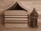 A pile of old home shaped books and a silver Ramadan (Ramazan) lantern. Sepia colour.