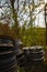 Pile of old rims thrown away into nature