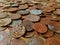 A pile of old, tarnished, corroded British copper coins