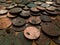 A pile of old, tarnished, corroded British copper coins