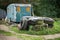 A pile of old tyres in front of an abandoned caravan