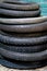 Pile of old vintage tyres inside a vintage old dusty workshop