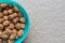 Pile of organic walnuts in a bowl, close up, clean eating concept