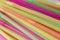 Pile of pastel colors plastic straws for beverage