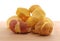 Pile of peeled potatoes on wooden board