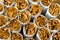 A pile, a pile of cigarettes in front of tobacco, a stack as a background texture, close-up, in front.