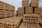 Pile of pine logs in a sawmill, close up.