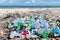 Pile of Plastic Bottles Strewn along a Beach AI Generated