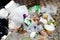 Pile of plastic garbage on the floor, garbage plastic waste glass and straws, plastic bag waste, trash foam tray foods waste