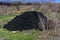 Pile of pulp in the field. Waste from the processing of granite