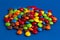 Pile of Rainbow Colored Candy Coated Chocolate Buttons